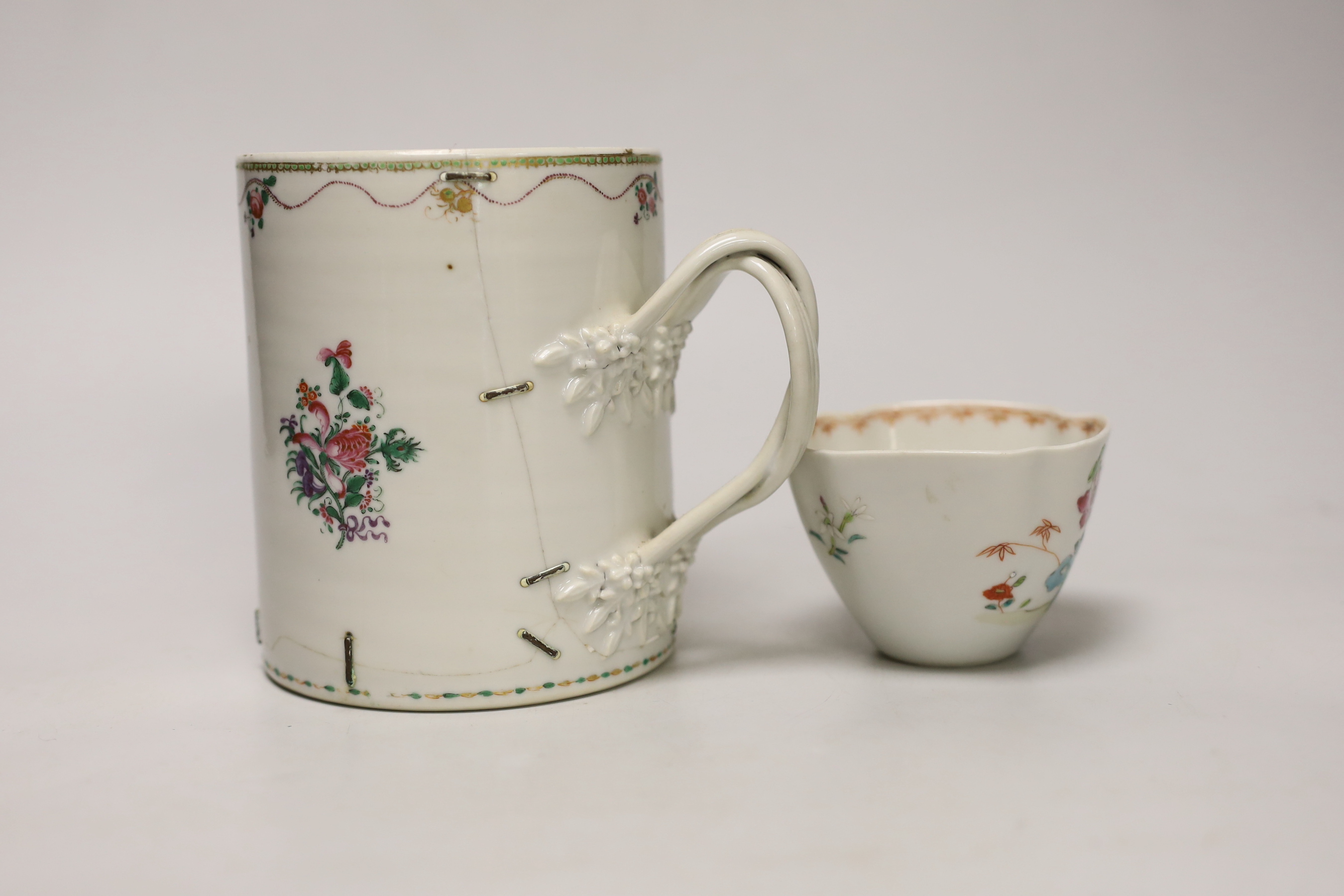 An 18th century Chinese export mug and a famille rose teabowl, tallest 13.5cm